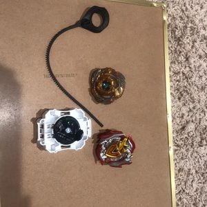 A yellow dragon BEYBLADE with a red BEYBLADE